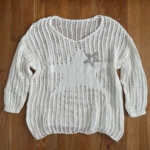 White knitted star sweater with silver accents